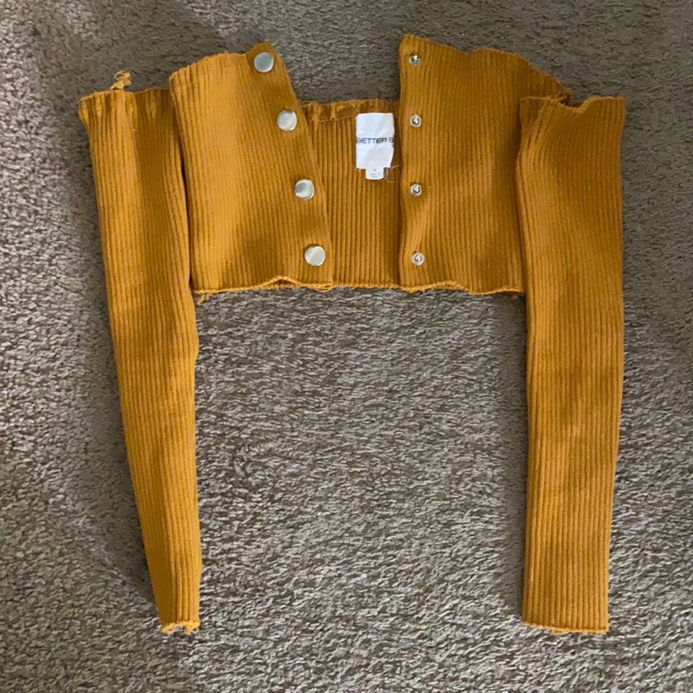 Long sleeve crop . It’s thick and pretty tight for a medium .